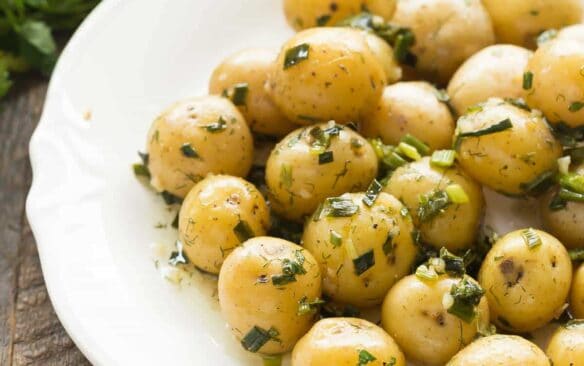 This no mayo Garlic Herb Potato Salad is great warm or cold -- the perfect make ahead side dish for summer barbecues, loaded with fresh herbs! Includes step by step recipe video. | light recipe | low calorie | diet | healthy recipe | healthy side | summer salad | warm potato salad |