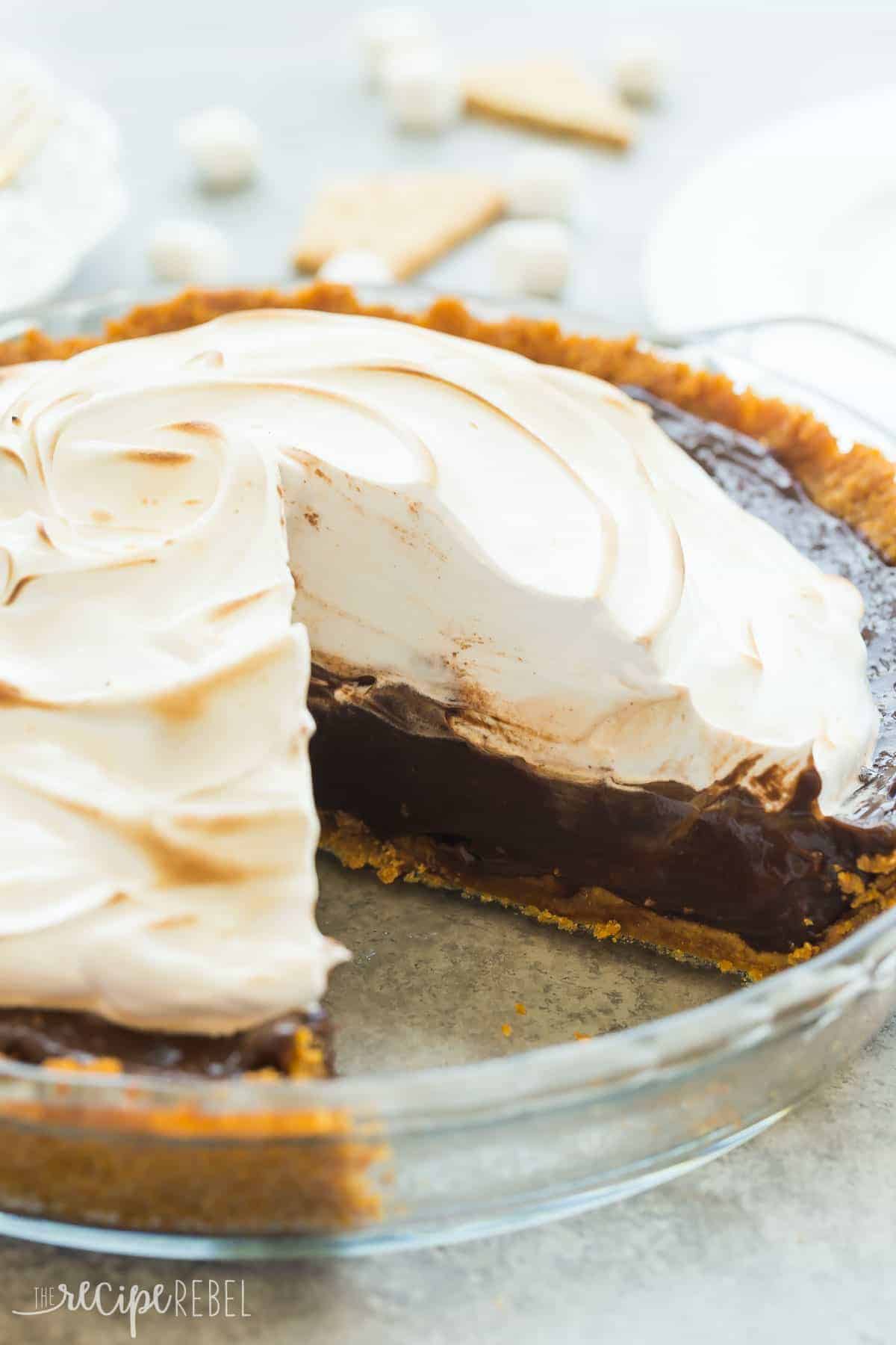 smores pie in glass pie plate whole with piece missing