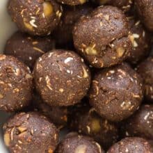 This No Bake Chocolate Hazelnut Energy Bites Recipe is made with oats, hazelnuts, cocoa and sweetened with dates -- they are the perfect healthy snack for lunches or school or work! They are so easy to make -- includes a step by step recipe video. | healthy recipe | protein ball | energy ball | exercise snack | workout snack | healthy recipe | healthy snack