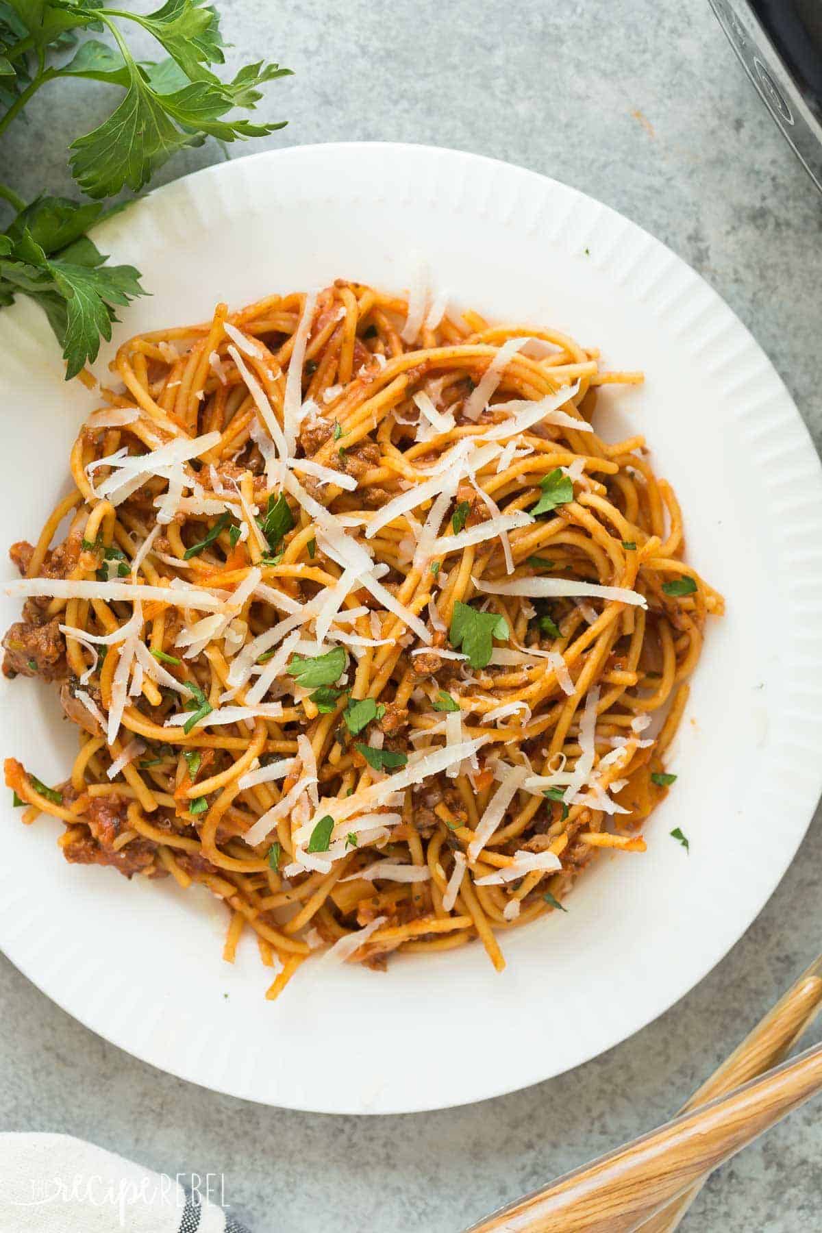 overhead close up image of healthier spaghetti and meat sauce on white plate