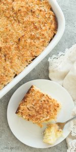 This Hot Milk Cake with Broiled Coconut Frosting -- also known as a Lazy Daisy Cake -- is a super moist vanilla cake covered in a crunchy, toasted coconut topping. It's one of my favorite cakes of all time! Includes a step by step recipe video. | easter | spring | Easter dessert | coconut dessert | baking | cooking | easy recipe