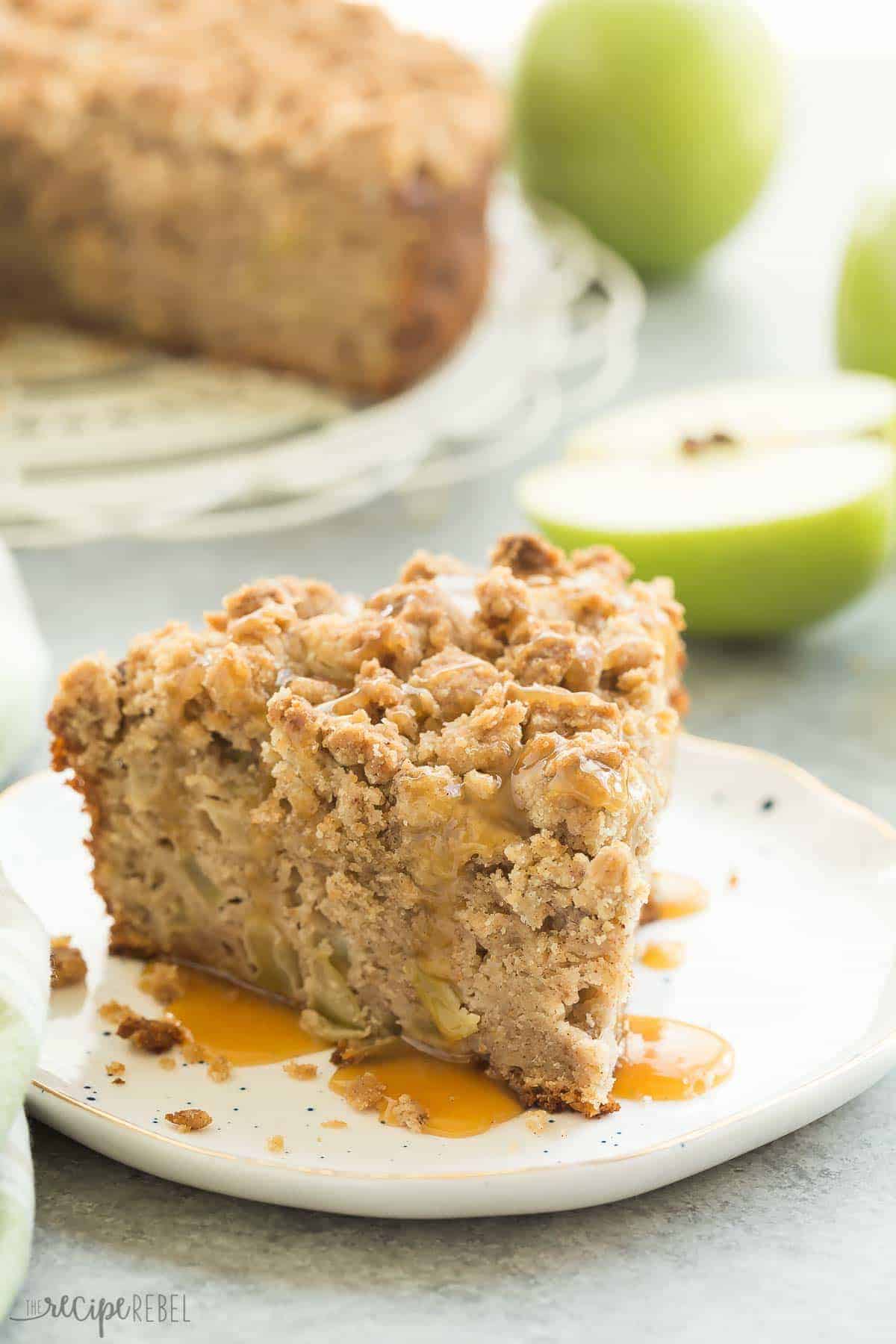 slice of apple coffee cake on white plate with caramel drizzle