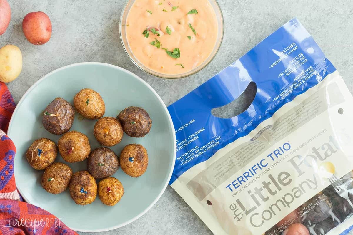 overhead image of nacho roasted potatoes bowl of queso and bag of little potatoes