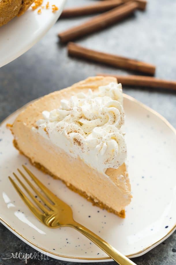 no bake pumpkin cheesecake with whipped cream swirls and a dusting of cinnamon