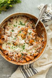 This One Pot Baked Ziti with Italian Sausage is full of flavor but easy on the dishes! It's made with turkey Italian sausage, spinach, tomato sauce and loaded with cheese -- the perfect weeknight dinner! Includes step by step recipe video. | easy recipe | easy dinner | healthy recipe | weeknight meal