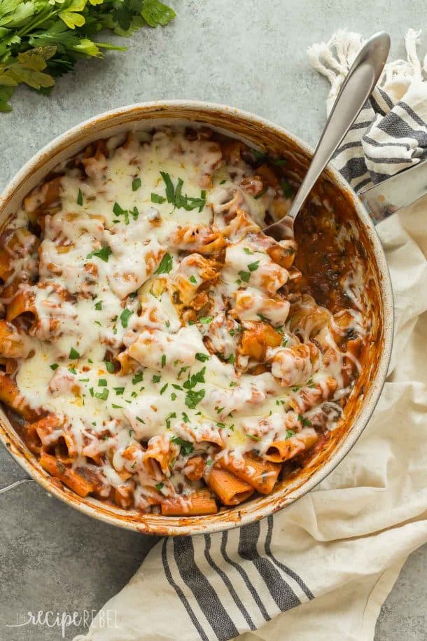 one pot baked ziti overhead in large pan with white towel on the side