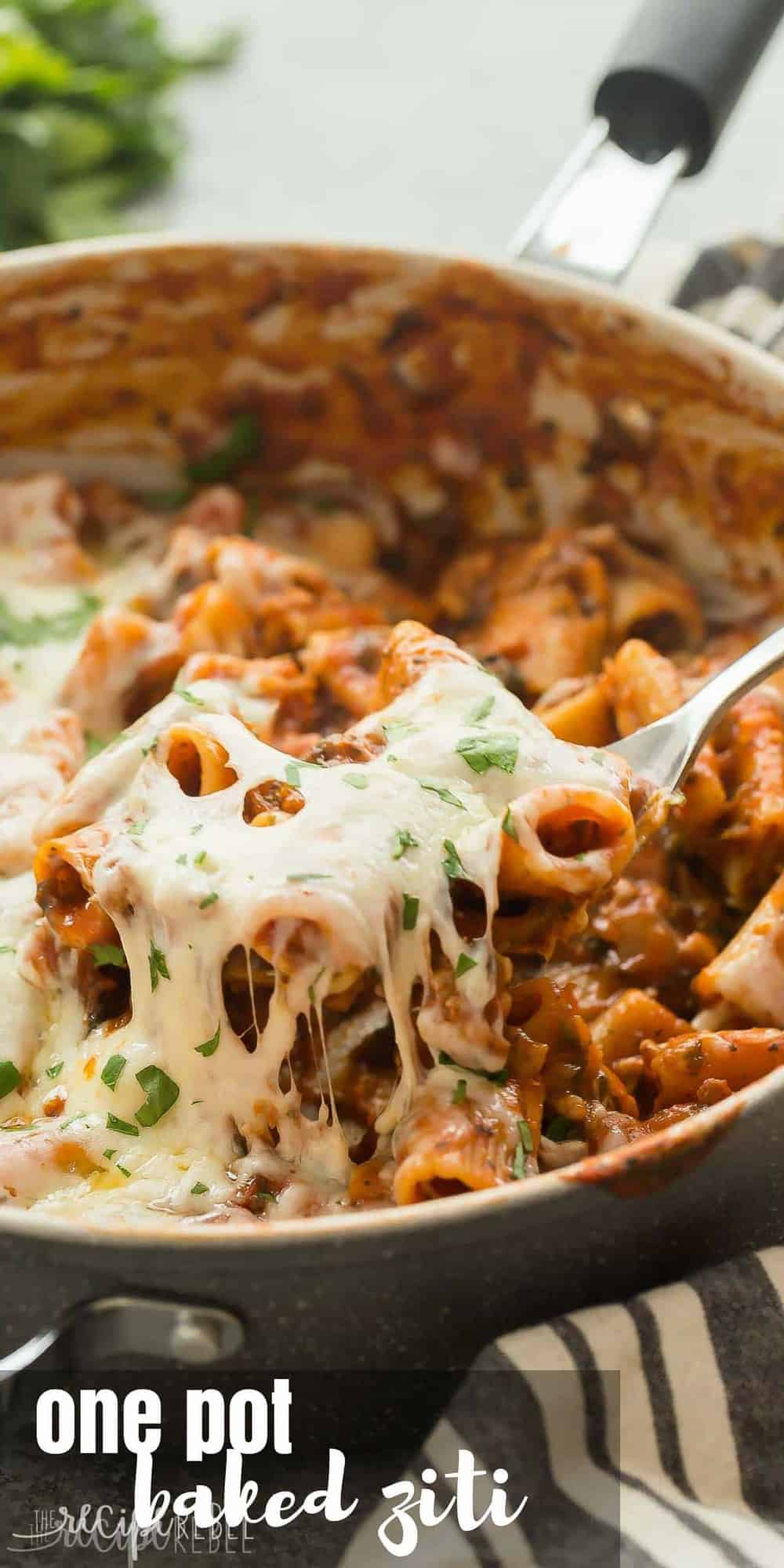 long image of one pot baked ziti being pulled out of skillet with spoon