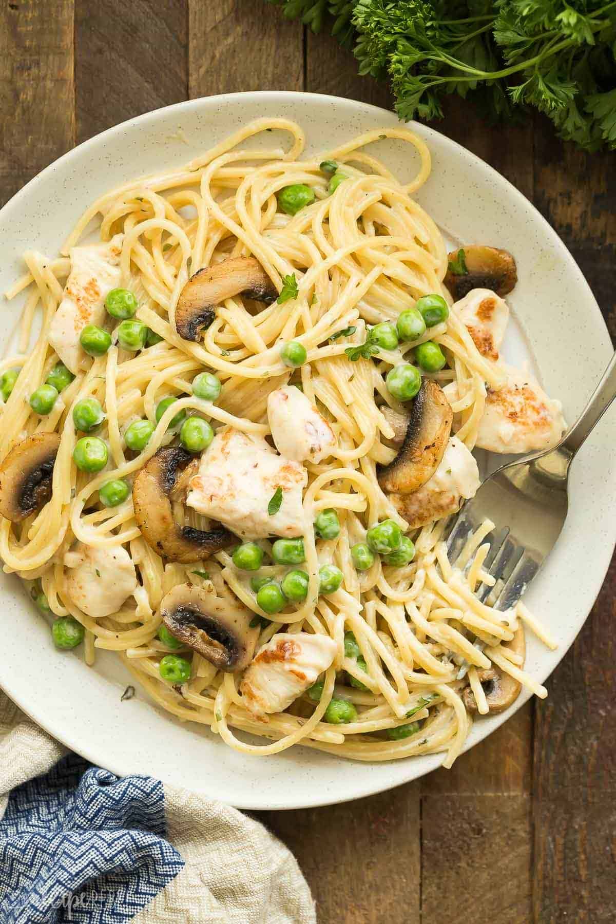 overhead image of plate of turkey tetrazzini with fork stuck in noodles