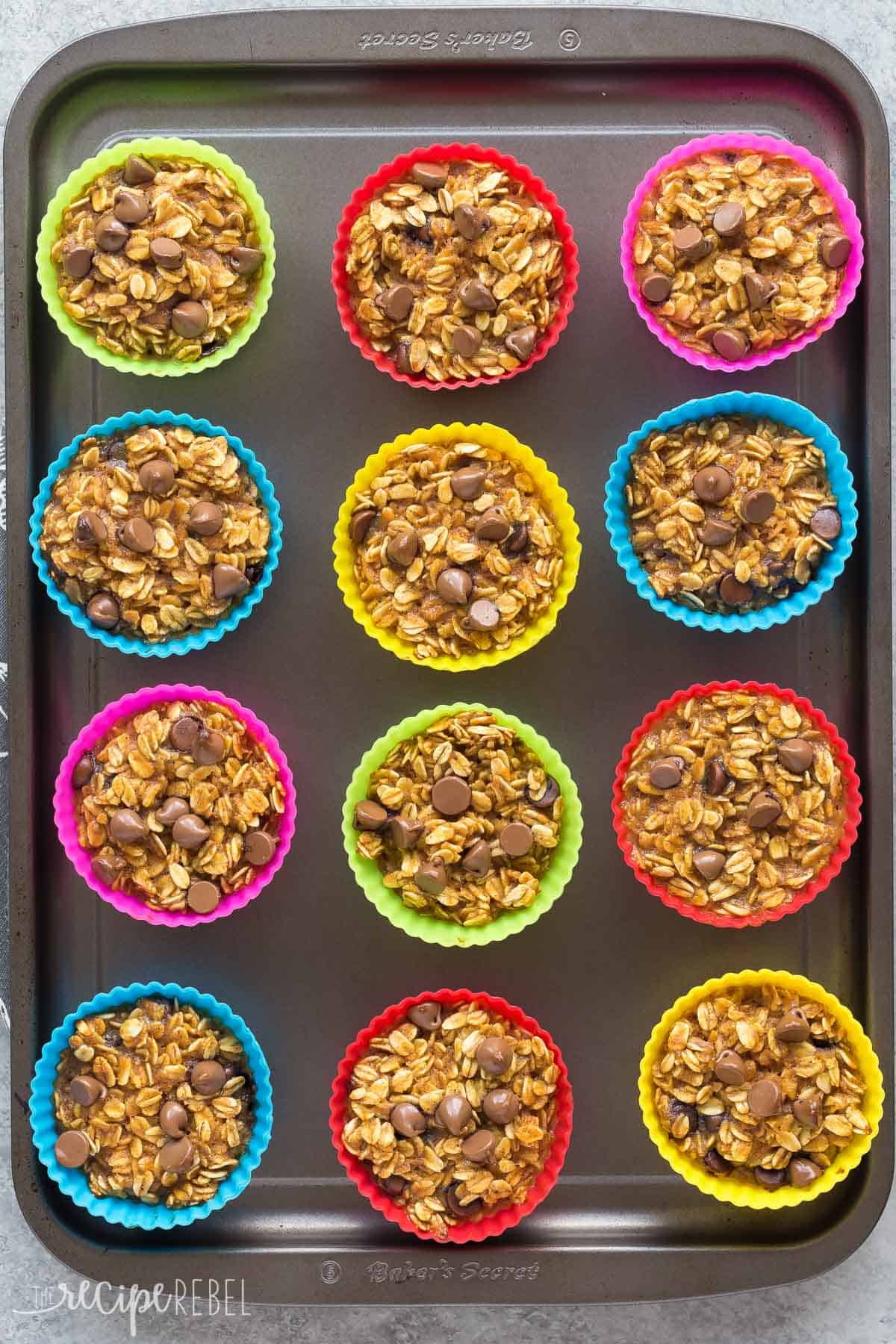 pumpkin oatmeal cups in silicone muffin wrappers on sheet pan overhead