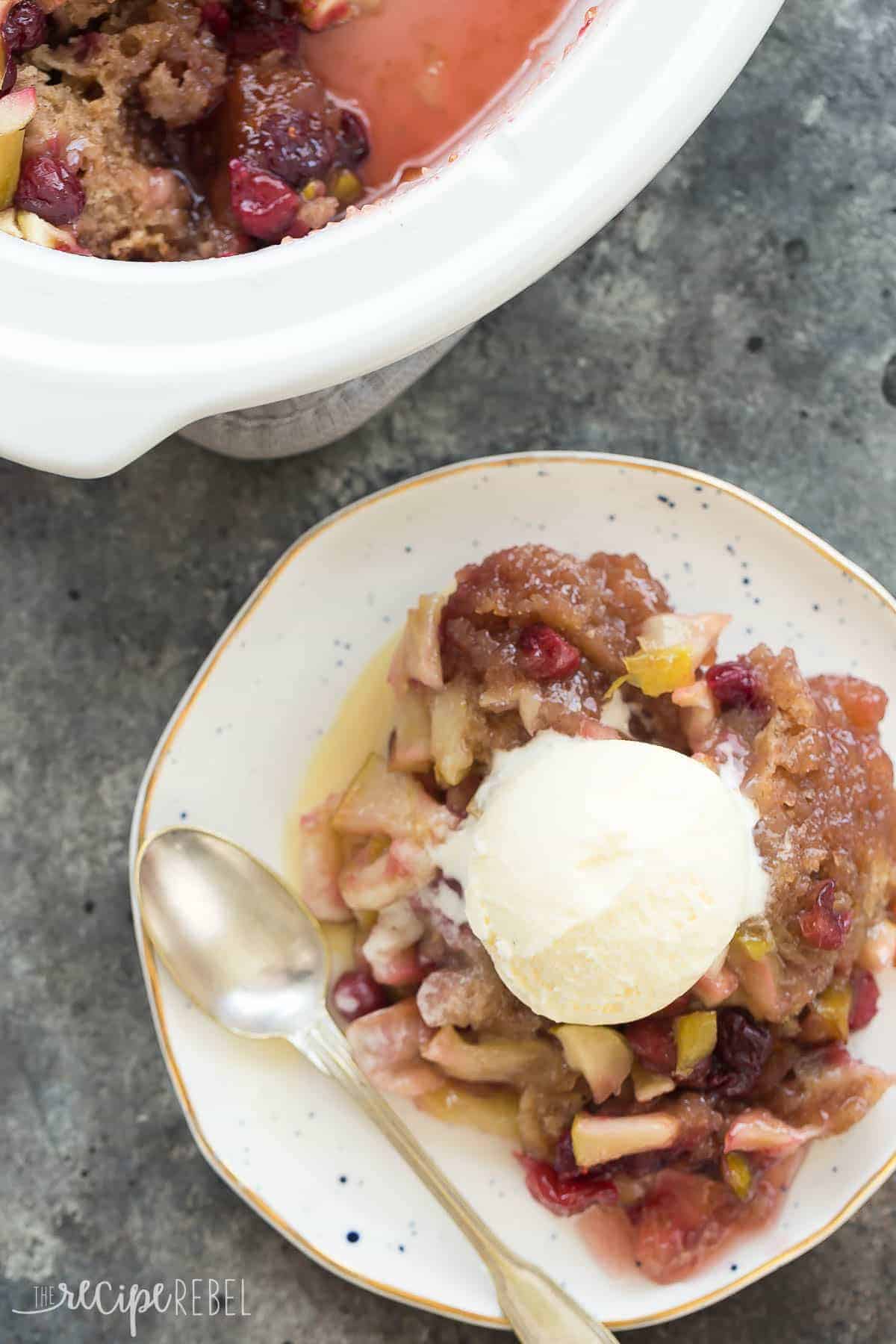 overhead image of plate of cranberry apple cobbler with scoop of vanilla ice cream