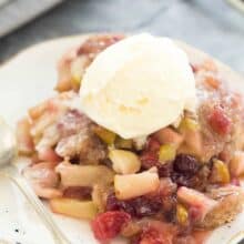 This Slow Cooker Cranberry Apple Cobbler is an easy dessert for fall or Thanksgiving! It makes its own gooey cranberry apple sauce as it cooks -- all you need is a scoop of ice cream! Includes step by step recipe video. | slow cooker recipe | slow cooker dessert | crock pot recipe | crock pot dessert | fall dessert | thanksgiving dessert