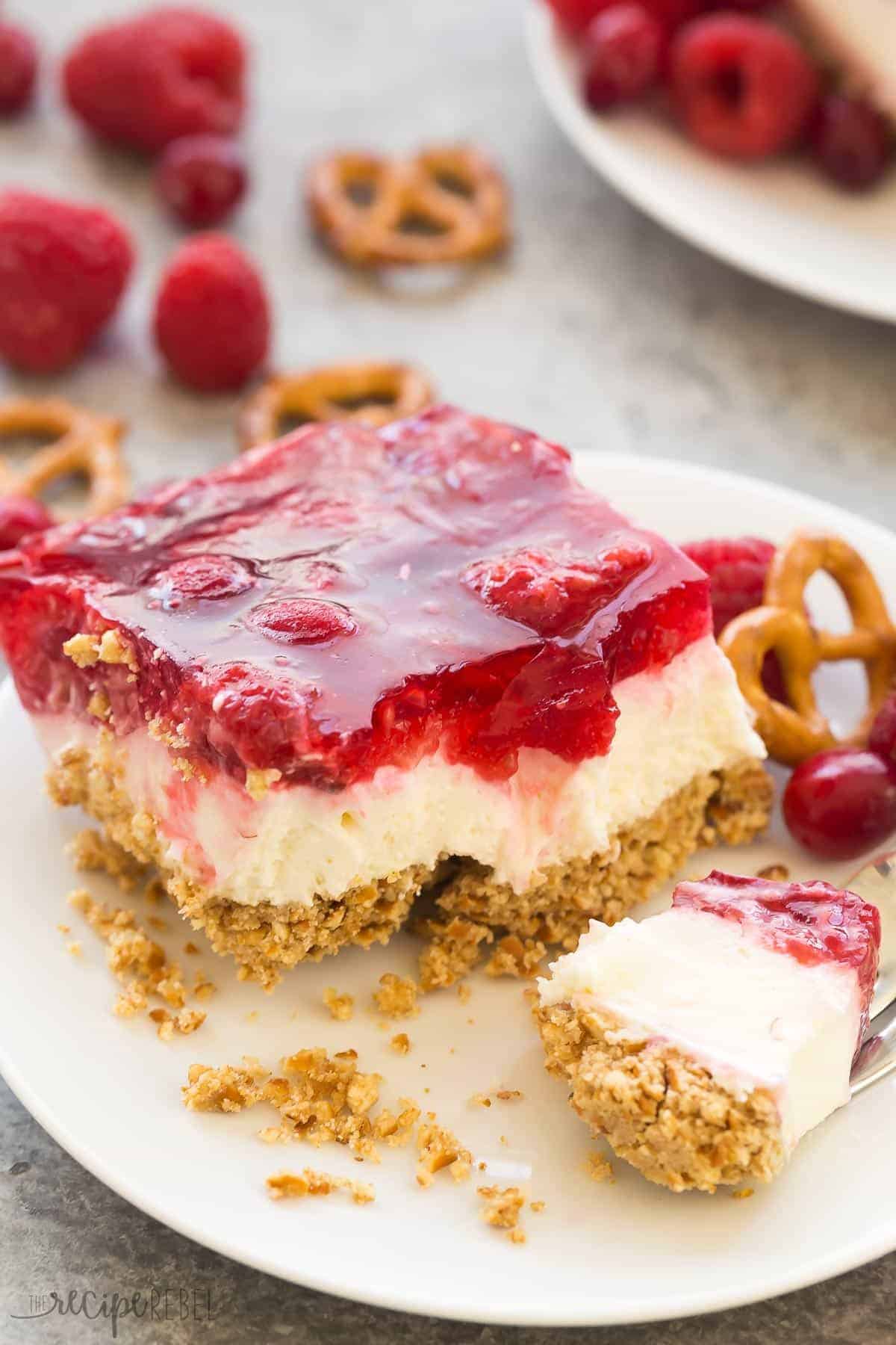 cranberry raspberry pretzel salad with bite on fork