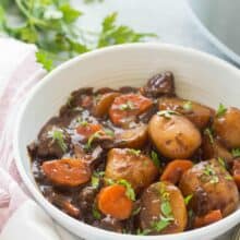 This Honey Balsamic Slow Cooker Beef Stew is full of flavor and couldn't be easier -- just throw everything in and let it cook! Loaded with veggies and thick honey balsamic sauce. Step by step recipe video. | slow cooker recipe | easy dinner recipe | healthy dinner recipe | fall food | soup | make ahead