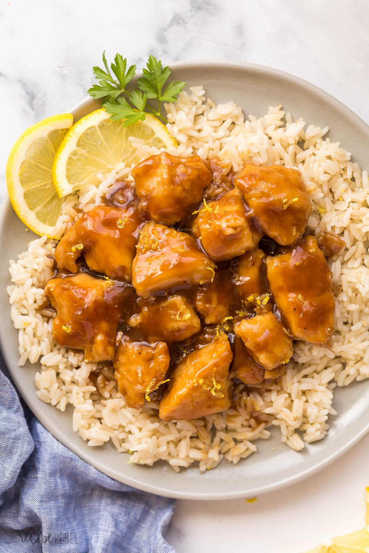 overhead image of lemon chicken on plate of rice