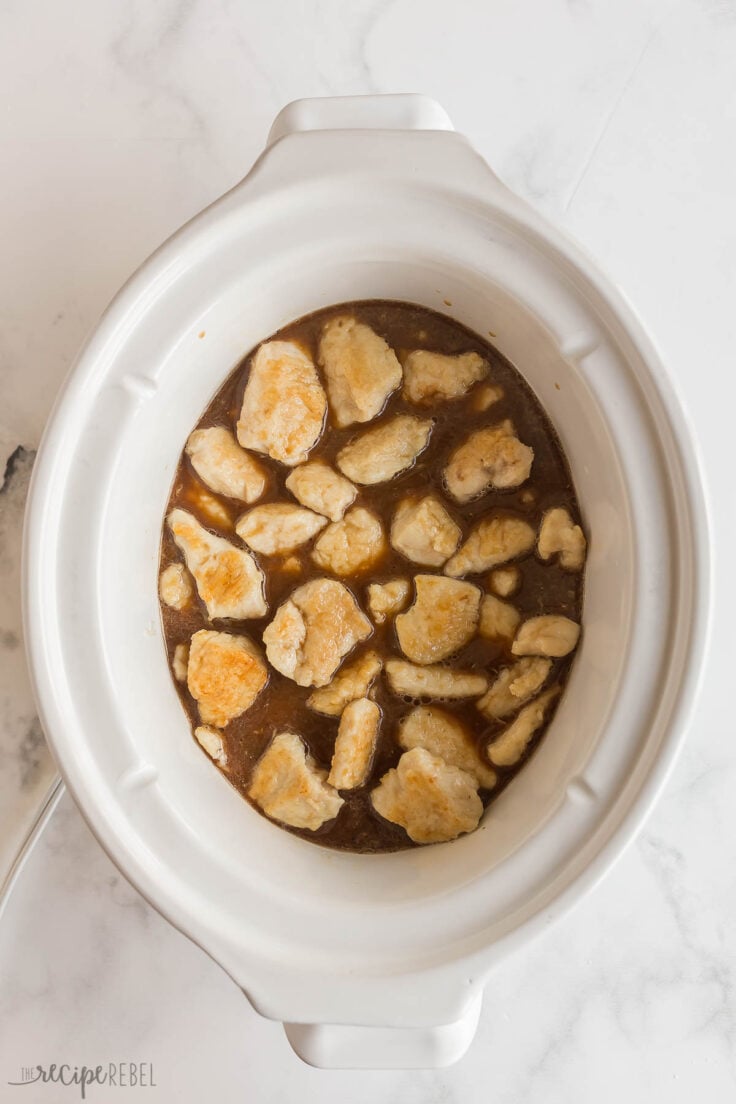 browned chicken with lemon sauce in slow cooker ready to cook