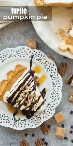This Turtle Pumpkin Pie is made on a flaky pie crust, topped with pecans, caramel and a no bake pumpkin pie filling! Make it in a graham cracker or Oreo crust for a completely no bake Thanksgiving dessert! Includes step by step recipe video. | pumpkin dessert | Thanksgiving dessert | caramel | chocolate | pecans | no bake dessert