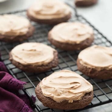 These Chocolate Sour Cream Sugar Cookies are super soft and smothered in chocolate cream cheese frosting -- it's everything a chocolate cookie should be! Includes a step by step recipe video. | double chocolate cookies | baking | dessert recipe | Christmas cookies |