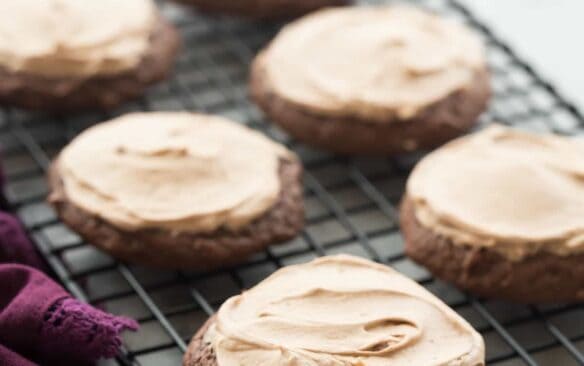 These Chocolate Sour Cream Sugar Cookies are super soft and smothered in chocolate cream cheese frosting -- it's everything a chocolate cookie should be! Includes a step by step recipe video. | double chocolate cookies | baking | dessert recipe | Christmas cookies |