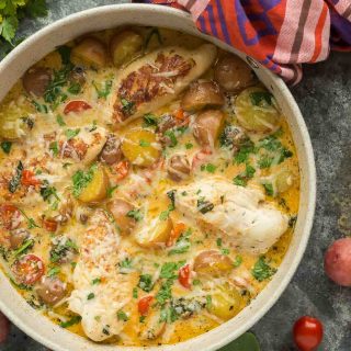This One Pan Tuscan Chicken and Potato Skillet is an easy dinner idea that is loaded with flavor! With tomatoes, spinach, potatoes and a light Parmesan cream sauce, it's perfect one pot comfort food. Includes step by step recipe video. | chicken dinner | healthy dinner idea | one pot meal | one pan meal | italian chicken | gluten-free