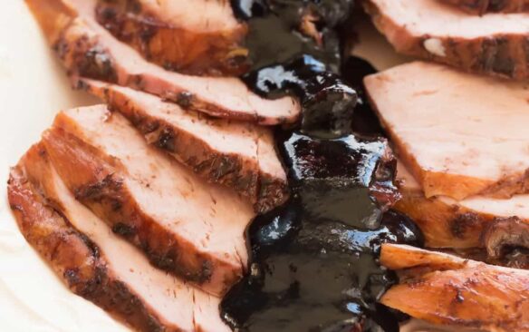 This Slow Cooker Balsamic Cherry Glazed Ham couldn't be easier -- the slow cooker keeps the meat so juicy and the Balsamic Cherry Glaze adds so much sweet and tangy flavor! It's perfect for Easter, Christmas or Thanksgiving. Includes step by step recipe video. | slow cooker recipe | crockpot | crock pot | holiday | sauce | cherry sauce | glaze for ham