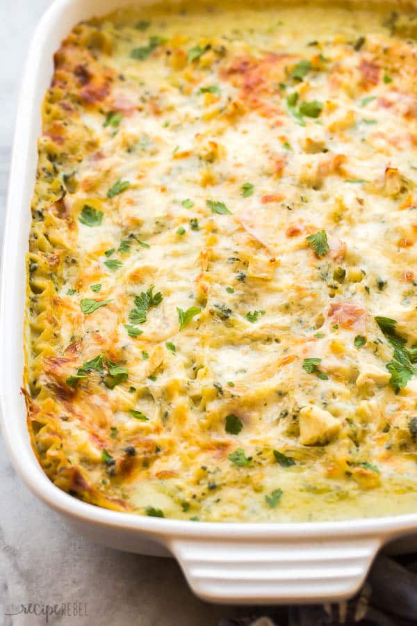 close up image of whole white chicken lasagna in pan
