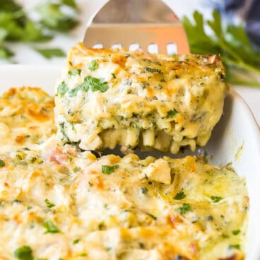 Piece of white lasagna being lifted out of pan