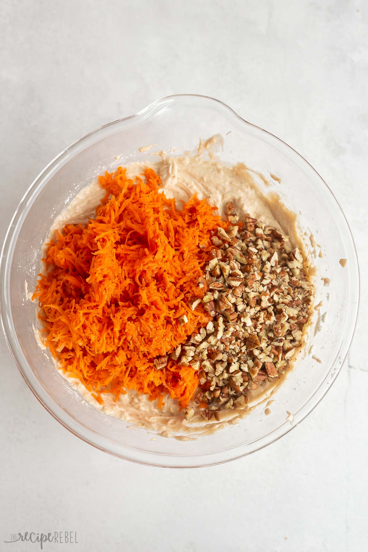 shredded carrots and chopped nuts added to carrot cake batter