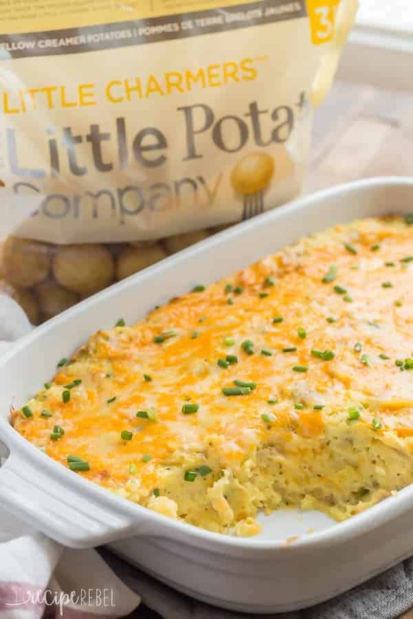 white baking dish with make ahead mashed potatoes and bag of little potatoes in the background