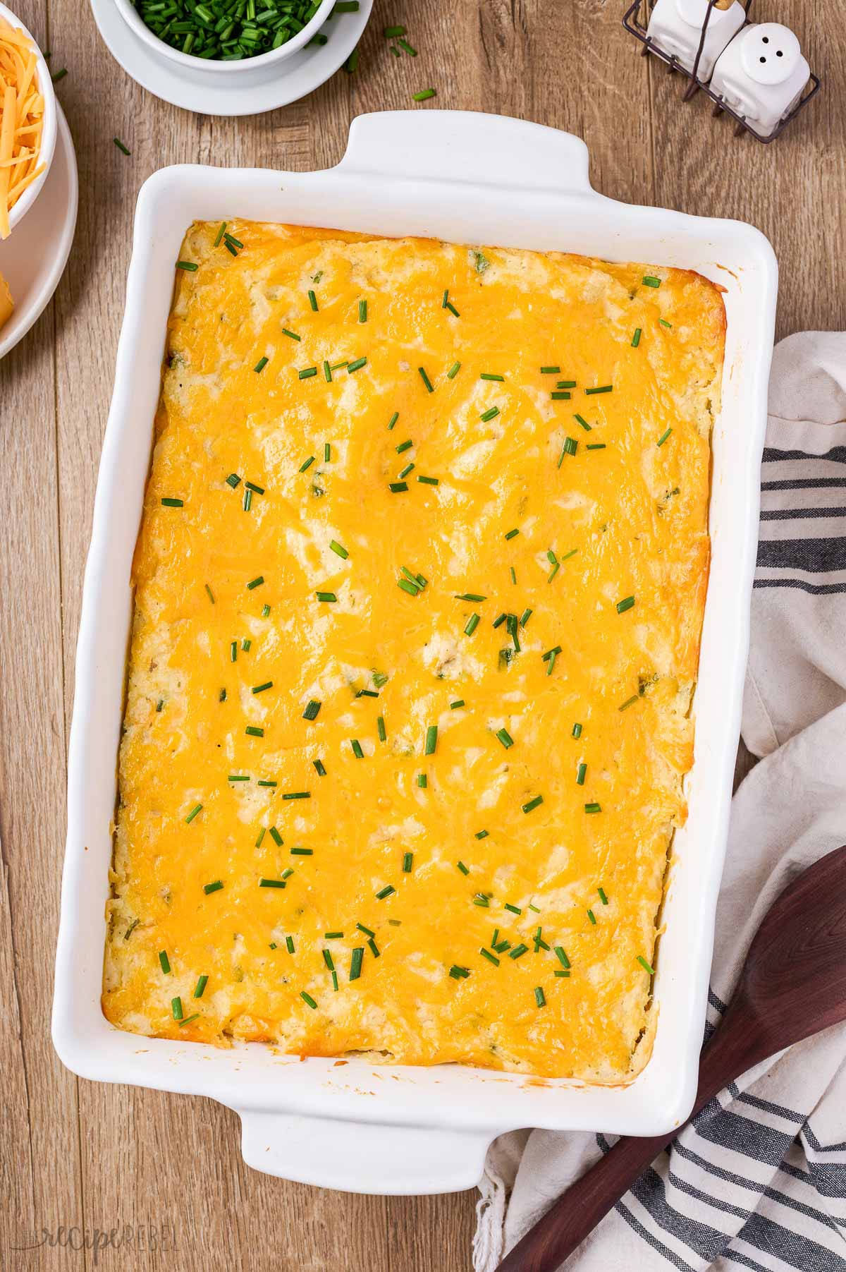 overhead image of cheesy make ahead mashed potatoes with chives on top