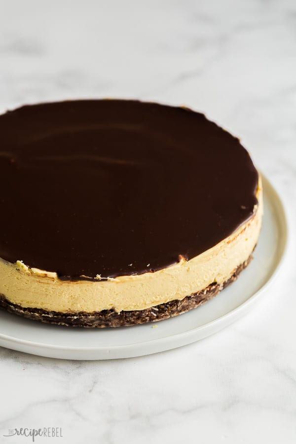 no bake nanaimo bar cheesecake whole with chocolate ganache