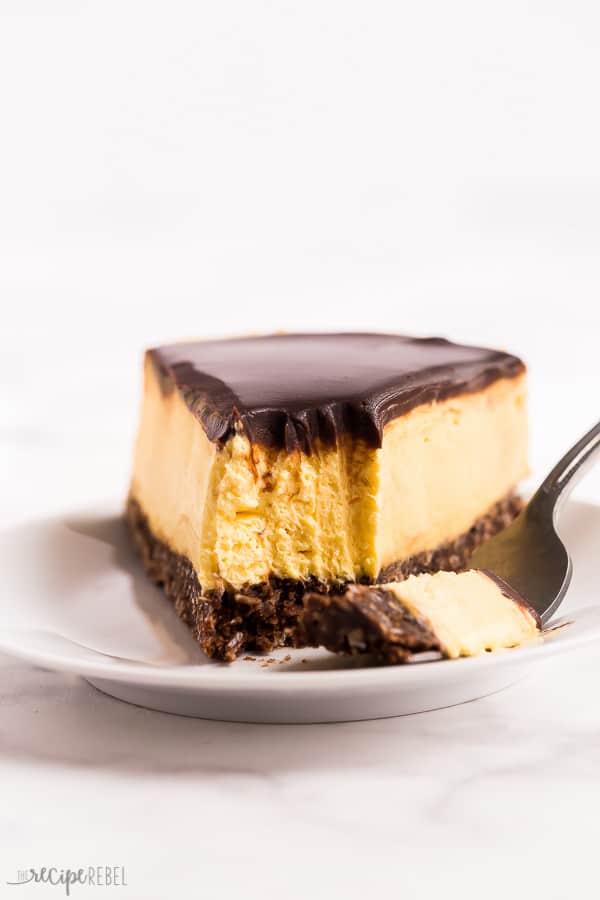 no bake nanaimo bar cheesecake bite close up on white plate with white background