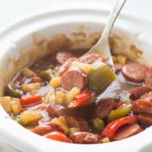 These Sweet & Sour Slow Cooker Smokies are an easy holiday appetizer or weeknight meal! Just a few minutes prep and let them cook away in the crockpot. Includes step by step recipe video. | slow cooker appetizer | slow cooker recipe | crock pot appetizer | holiday dish | game day | superbowl | potluck recipe | easy recipe