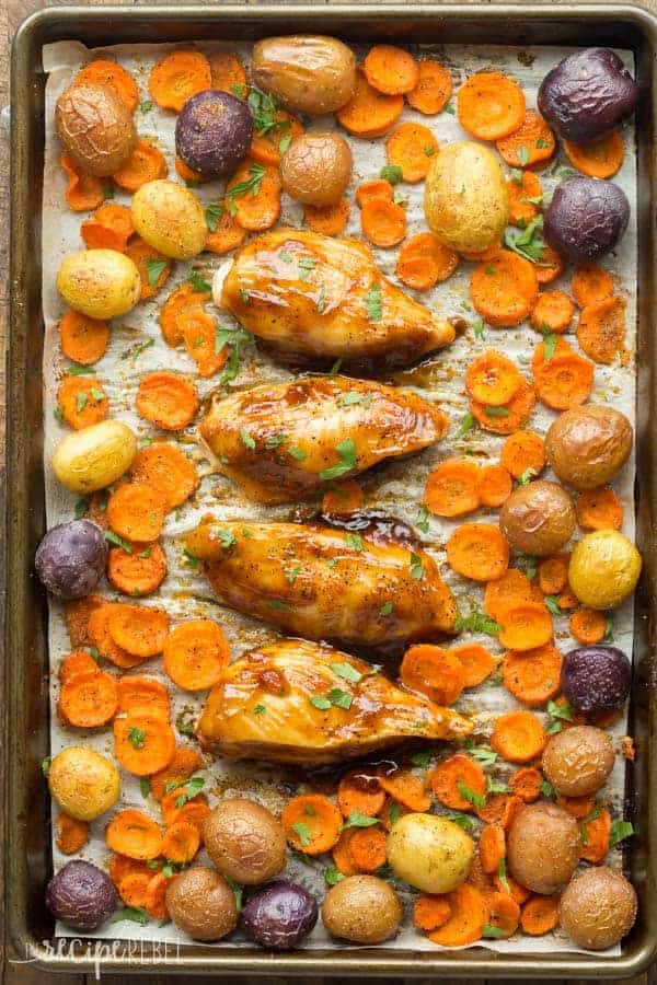 apricot chicken sheet pan dinner overhead with little potatoes and sliced carrots