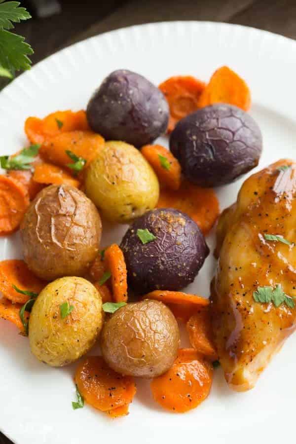 This Apricot Chicken Sheet Pan Dinner is an easy, healthy dinner recipe that requires just a few minutes prep and one pan! Loaded with potatoes and vegetables and topped with a simple apricot glaze. Includes step by step recipe video. | one pan dinner | one pan meal | glazed chicken | chicken and vegetables | healthy dinner idea | meal prep | low calorie