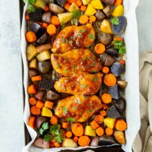 overhead image of apricot chicken sheet pan dinner on sheet pan