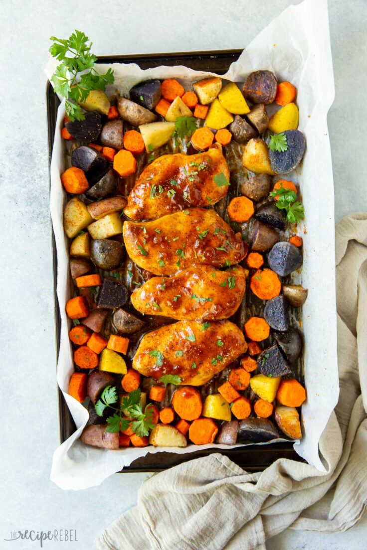 overhead image of apricot chicken sheet pan dinner on sheet pan
