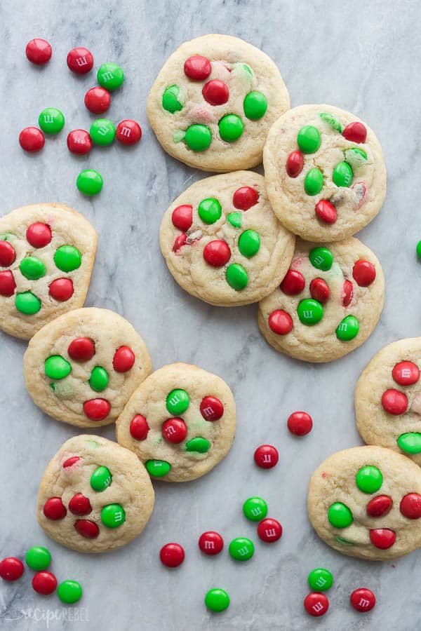 m&m cookies overhead on grey marble background with red and green m&ms