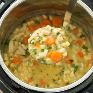 This Creamy Instant Pot Chicken Noodle Soup Recipe is a healthy dinner recipe that's easy enough for any day of the week! It's made in the pressure cooker which means BIG flavour and quick cooking. Loaded with vegetables and easily made dairy free or vegetarian. Includes step by step recipe video. | instant pot recipe | pressure cooker | healthy recipe | vegetables | spinach | pasta | one pot #onepot #instantpot #instantpotrecipe #pressurecooker