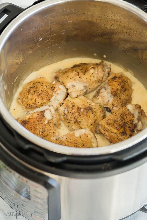 instant pot chicken thighs in pressure cooker with creamy garlic sauce