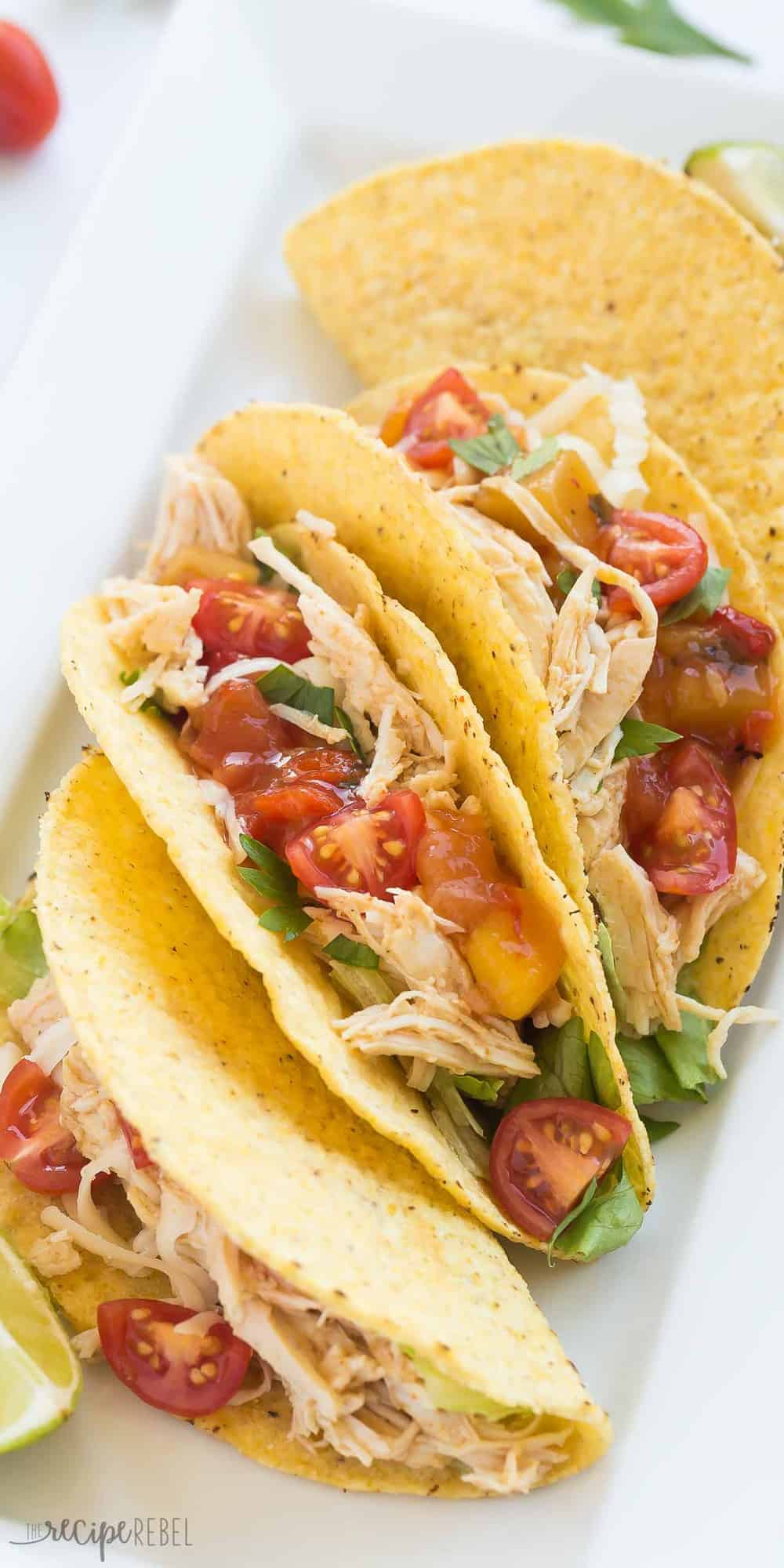 These Sweet & Spicy Slow Cooker Chicken Tacos are an easy, healthy, weeknight dinner! Just dump everything in the crockpot and forget about it. Step by step recipe video. | slow cooker recipes | crockpot recipe | crock pot recipe | chicken dinner | healthy recipe | low fat | low calorie | protein | game day | superbowl | #gameday #chickenrecipes #slowcookerrecipes