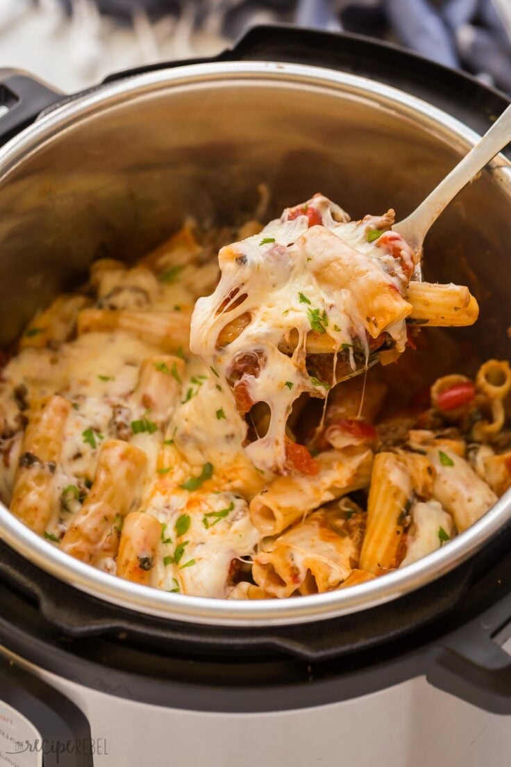 spoon taking a scoop of pasta out of instant pot