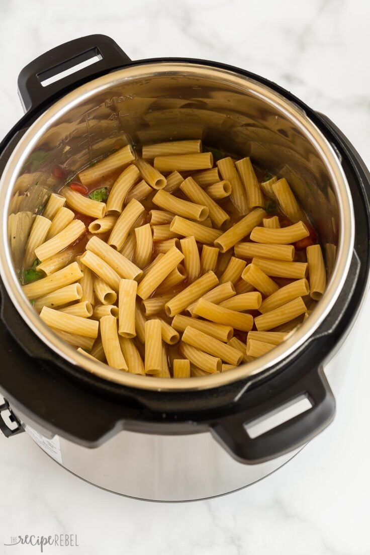 dry pasta on top of sauce in the instant pot