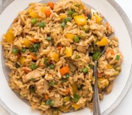 square image of instant pot teriyaki chicken and rice on white plate