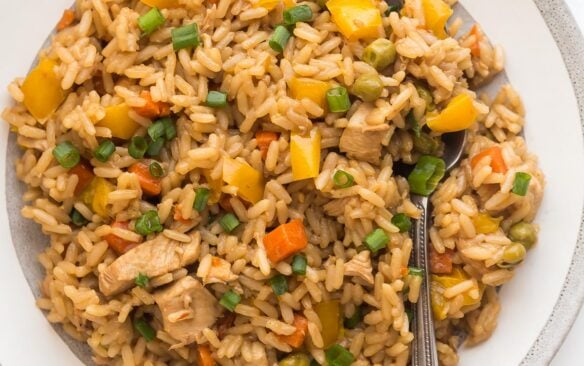 square image of instant pot teriyaki chicken and rice on white plate