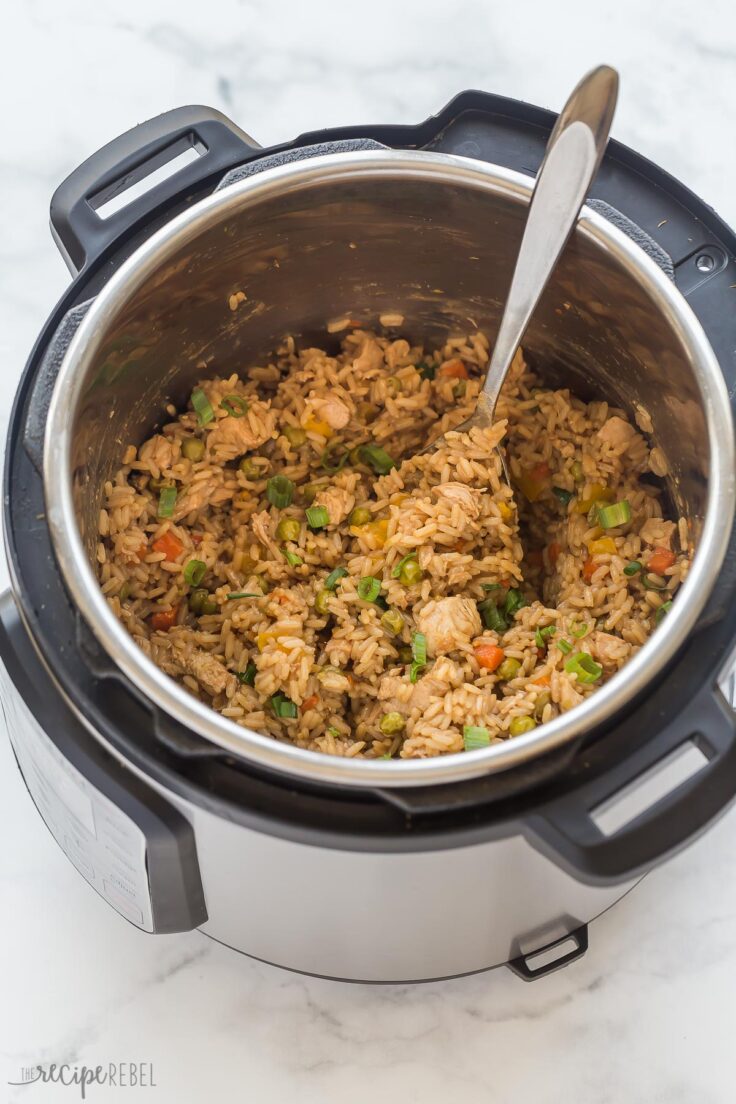 instant pot teriyaki chicken and rice in pressure cooker with wooden spoon