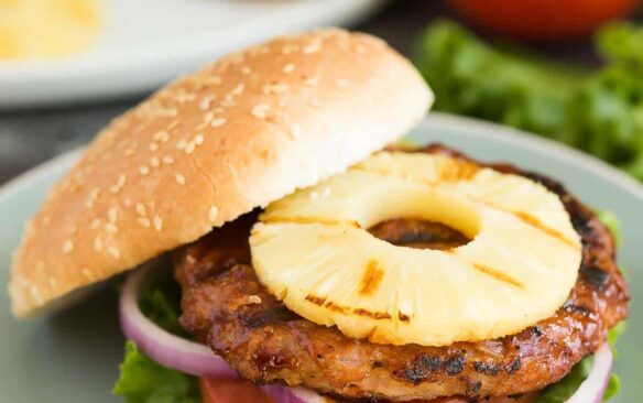 Hawaiian Chicken Burgers with Grilled Pineapple are an easy, healthy dinner recipe that's perfect for summer! Made with just a few simple ingredients and easy to make ahead or meal prep. Loaded with sweet and savoury flavours! Includes step by step recipe video.