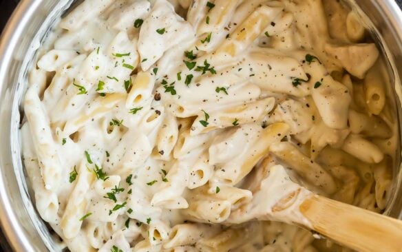 overhead image of chicken alfredo pasta in pressure cooker.