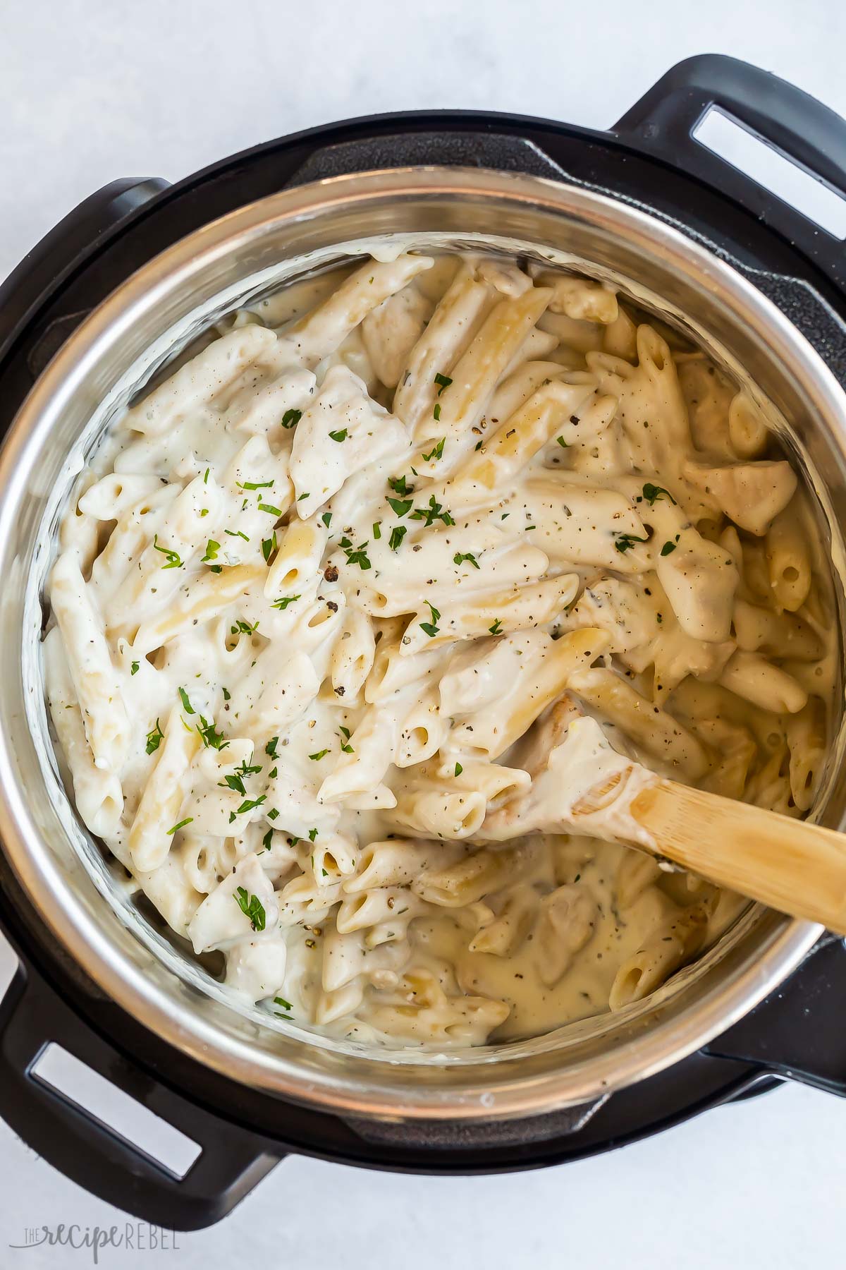 overhead image of chicken alfredo pasta in pressure cooker.