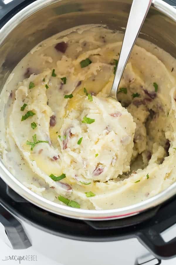 mashed potatoes in instant pot with metal spoon scooping some potatoes