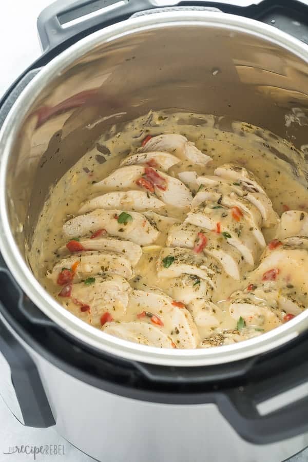 chicken breasts in instant pot sliced and sitting in creamy italian sauce